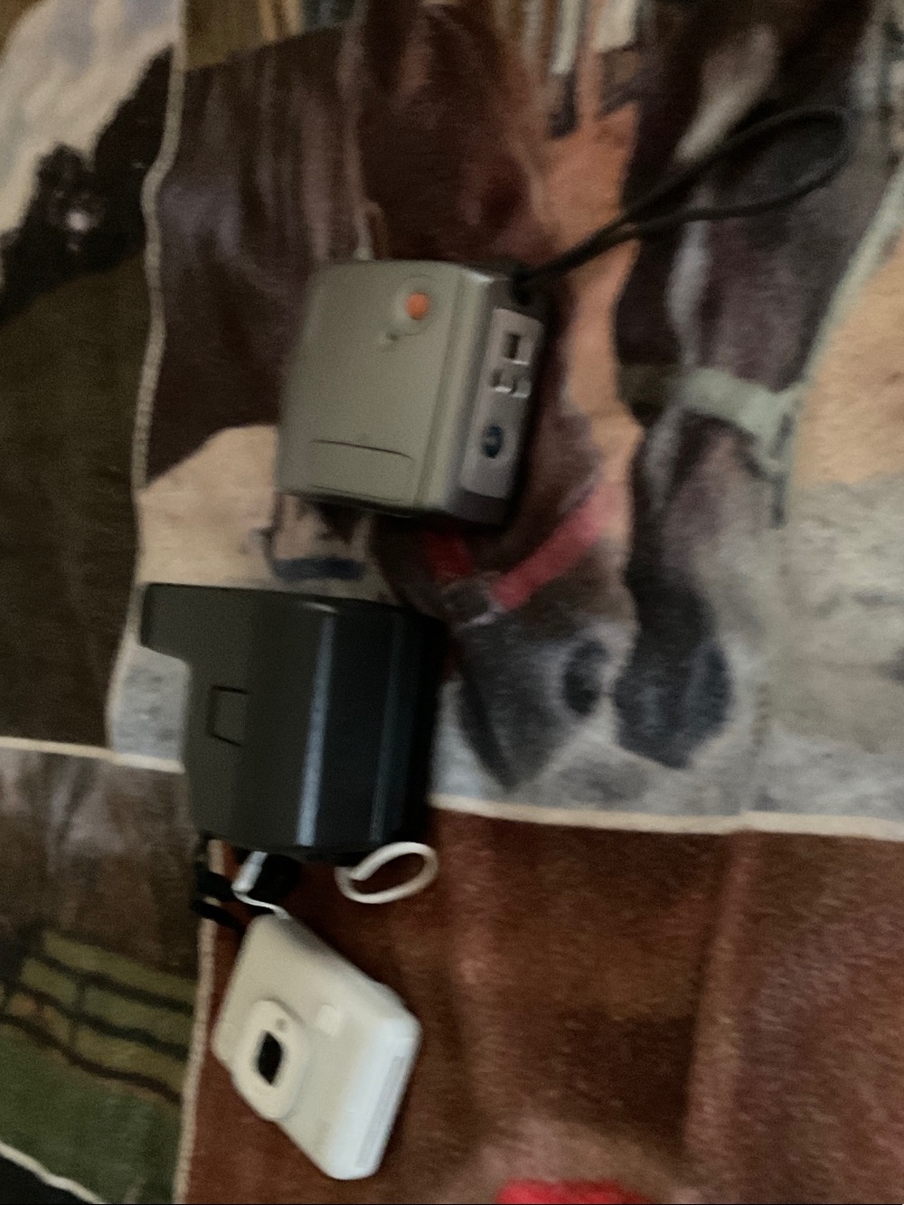 Polaroid Cameras and Chargers in Gray, Dark Gray, White